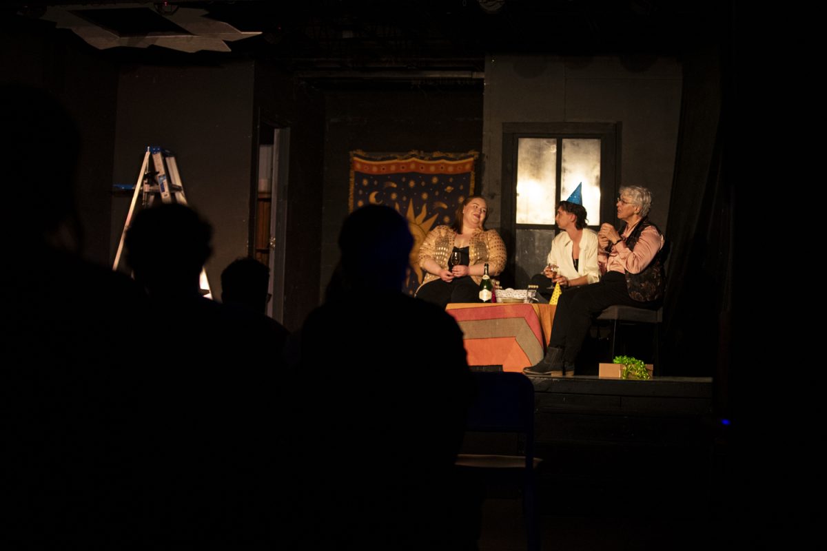 Emma Bibb, Owen Brightman and Mary Lukas perform during a showing of Eli Campbell’s Pleasure Play directed by Meredith Alexander at The Artifactory on North Dubuque Street in Iowa City on Saturday, Nov. 18, 2023.