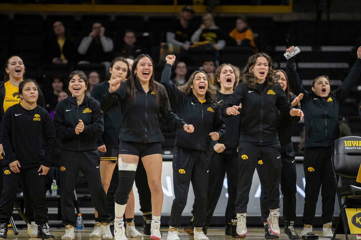 The Iowa women’s wrestling cheers during a Iowa Duals II at Carver-Hawkeye Arena on Saturday, Jan. 19, 2024. Iowa defeated Augustana College and no. 4 Grand Valley State, 44-1 and 35-7, respectively. 