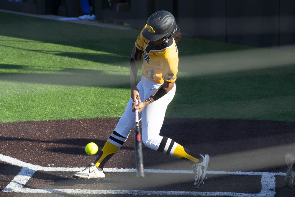 Iowa infielder Soo-jin Berry swings towards the ball during a women's softball game between Iowa and Penn State at Bob Pearl Softball Field in Iowa City on Monday, April 21, 2025. Berry earned one hit. The Hawkeyes defeated the Nittany Lions, 3-1.