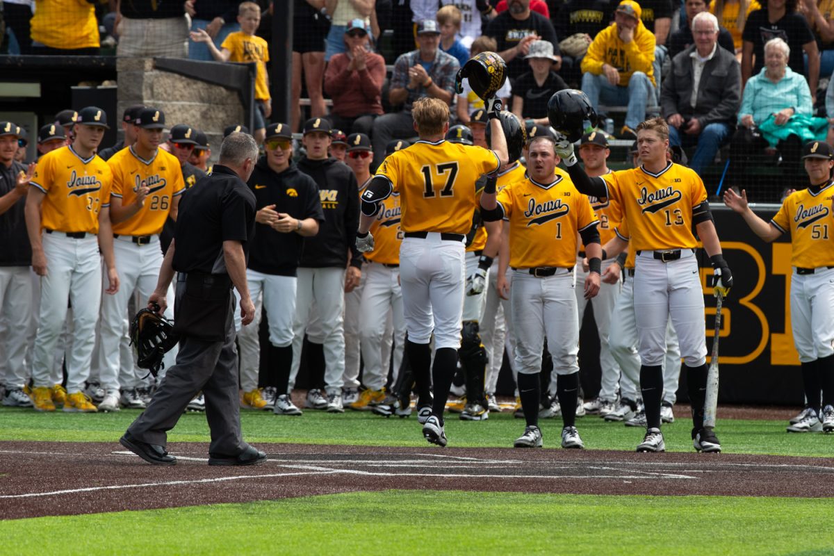 Iowa utility player Andy Nelson celebrates his home run with his teammates during a baseball game between Iowa and Indiana at Duane Banks Baseball Stadium in Iowa City on April 27, 2025. Nelson earned two runs and two hits. The Hawkeyes defeated the Hoosiers, 10-0.