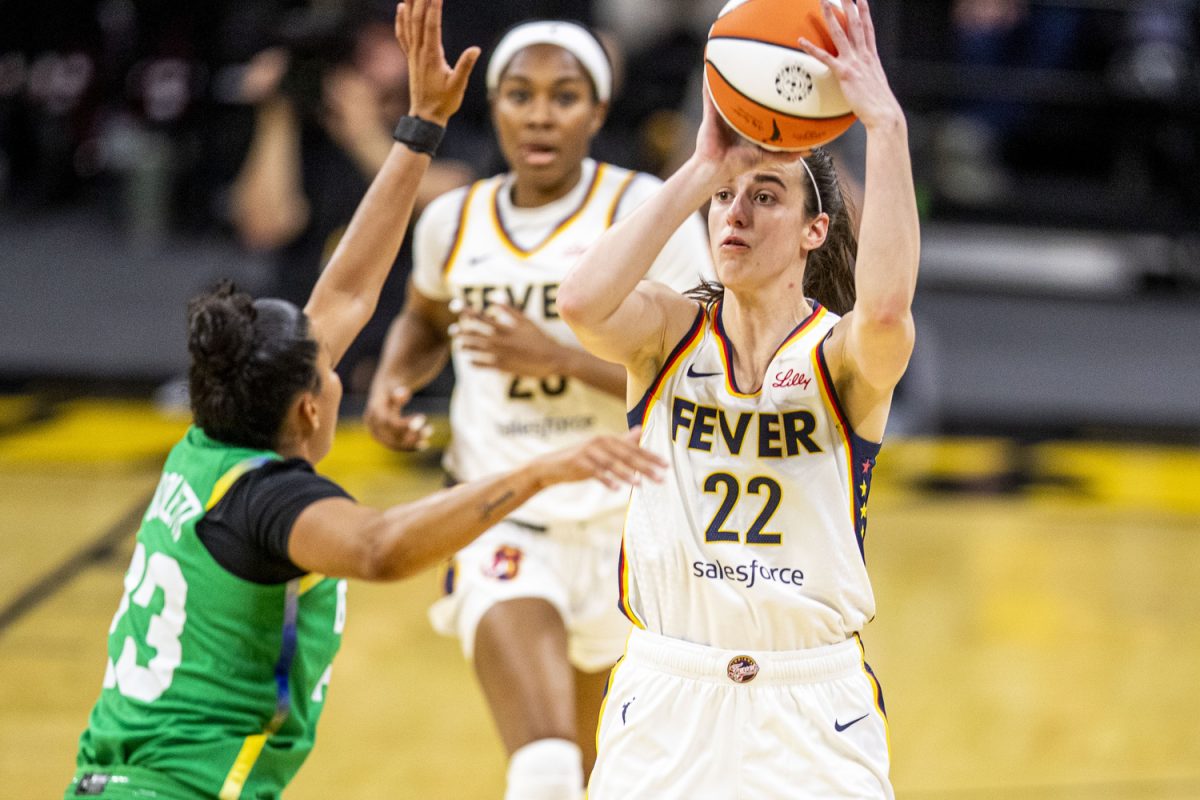 Indiana guard Caitlin Clark goes up for a logo three during a preseason women’s basketball game between the Indiana Fever and the Brazil National Team at Carver-Hawkeye Arena in Iowa City on Sunday, May 4, 2025. The three-point shot was taken beyond her all-time scoring record-breaking shot. The Fever defeated the Brazilian National Team 108-44.